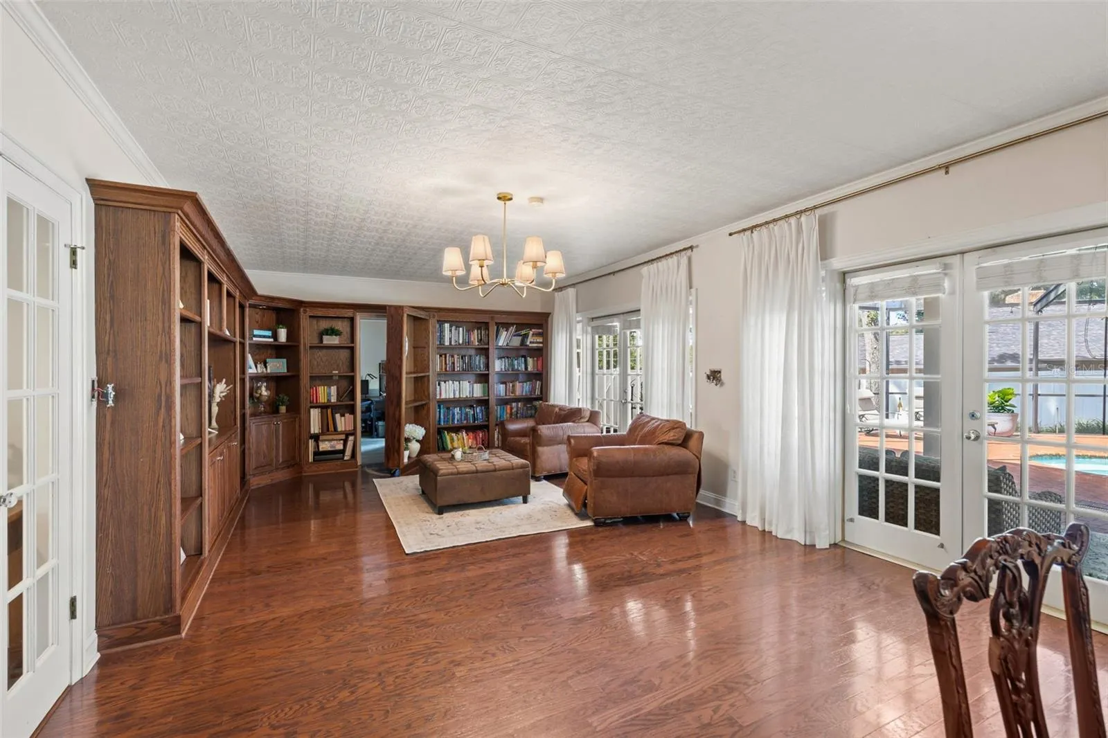 Huge Library with built-in bookcases and a HIDDEN DOOR to the first floor bedroom suite.