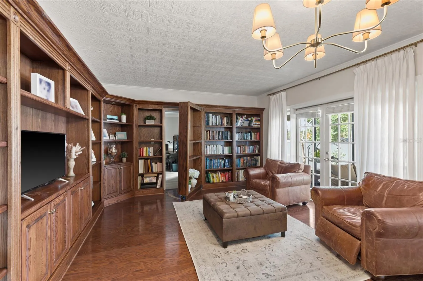 Huge Library with built-in bookcases and a HIDDEN DOOR to the first floor bedroom suite.