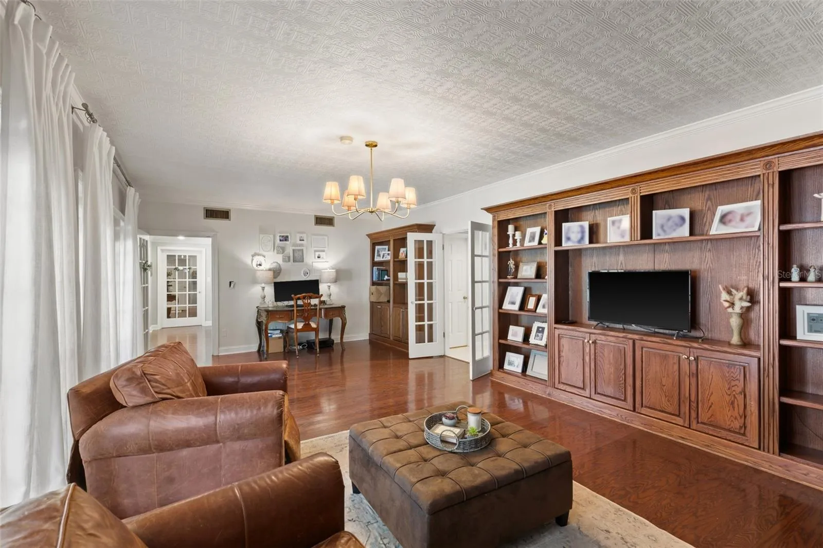 Huge Library with built-in bookcases and a HIDDEN DOOR to the first floor bedroom suite.