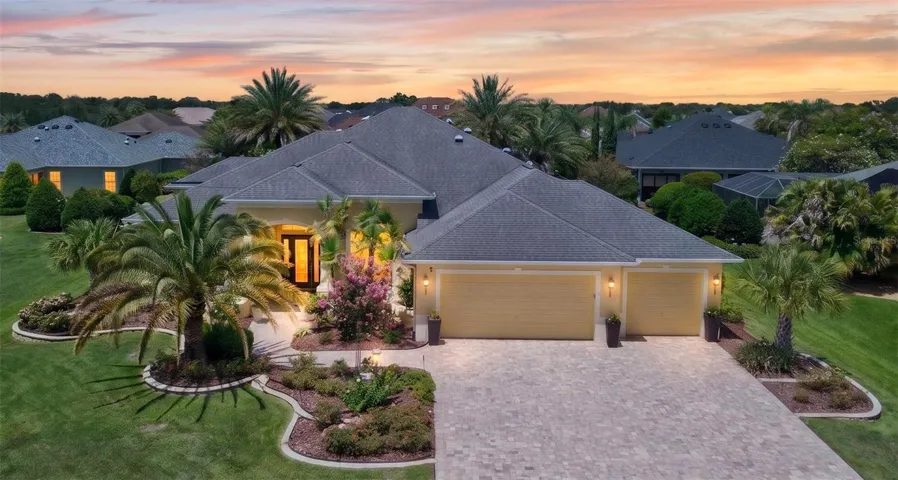 FRONT EXTERIOR @ Early Twilight - 622 Laurel Run in the VILLAGE of BRIDGEPORT @ LAUREL VALLEY -  Custom ST CHARLES Premier home w/ CBS exterior, 4 BR/3 BA/3 Car Garage, 3887 sf LA, a SOLAR HEATED, FRESHWATER POOL and a separate SPA w/ lush landscaping privacy.