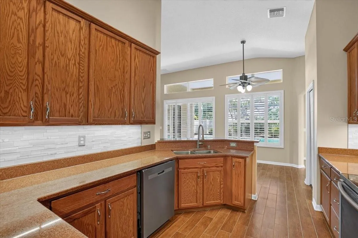 Kitchen looking at pool and eating area