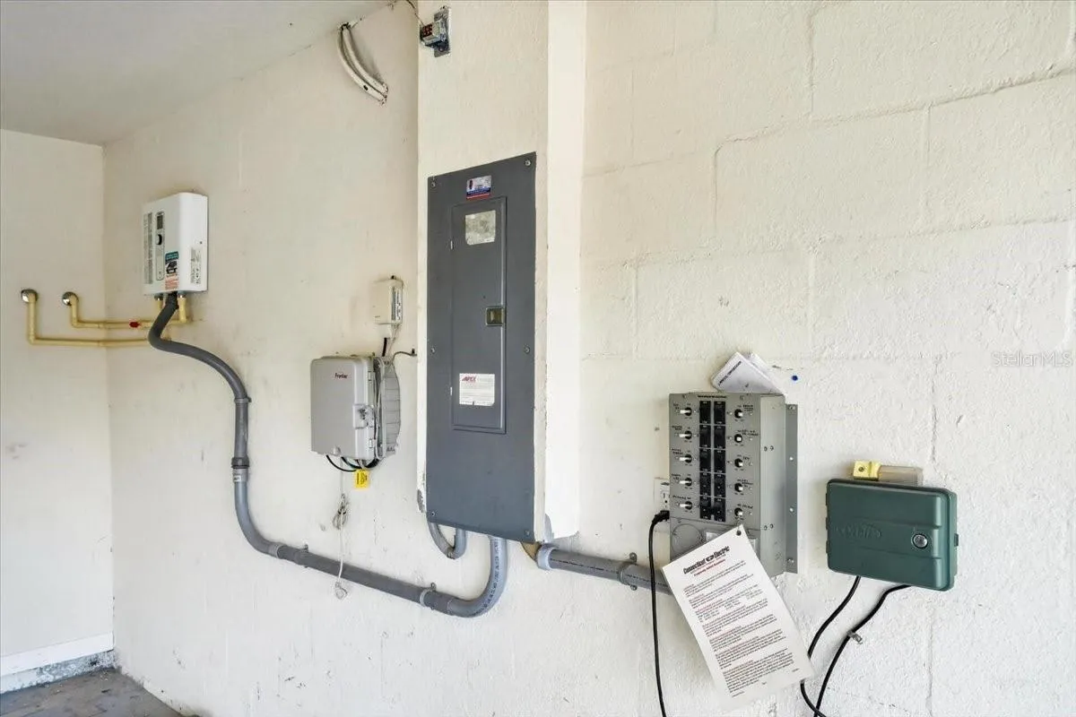 Electrical box that connects to generator, sprinkler system control, and tankless water heater in the garage