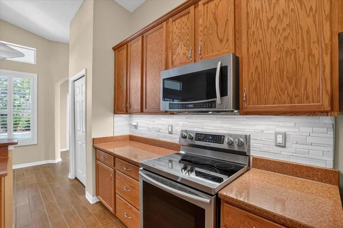 Kitchen looking towards beroom 4 and exit to pool and bathroom 3.
