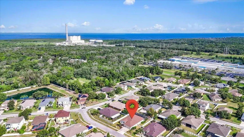 Drone view shows close proximity to the Gulf Of America and the Anclote river proximity that goes by the Duke electrical power plant