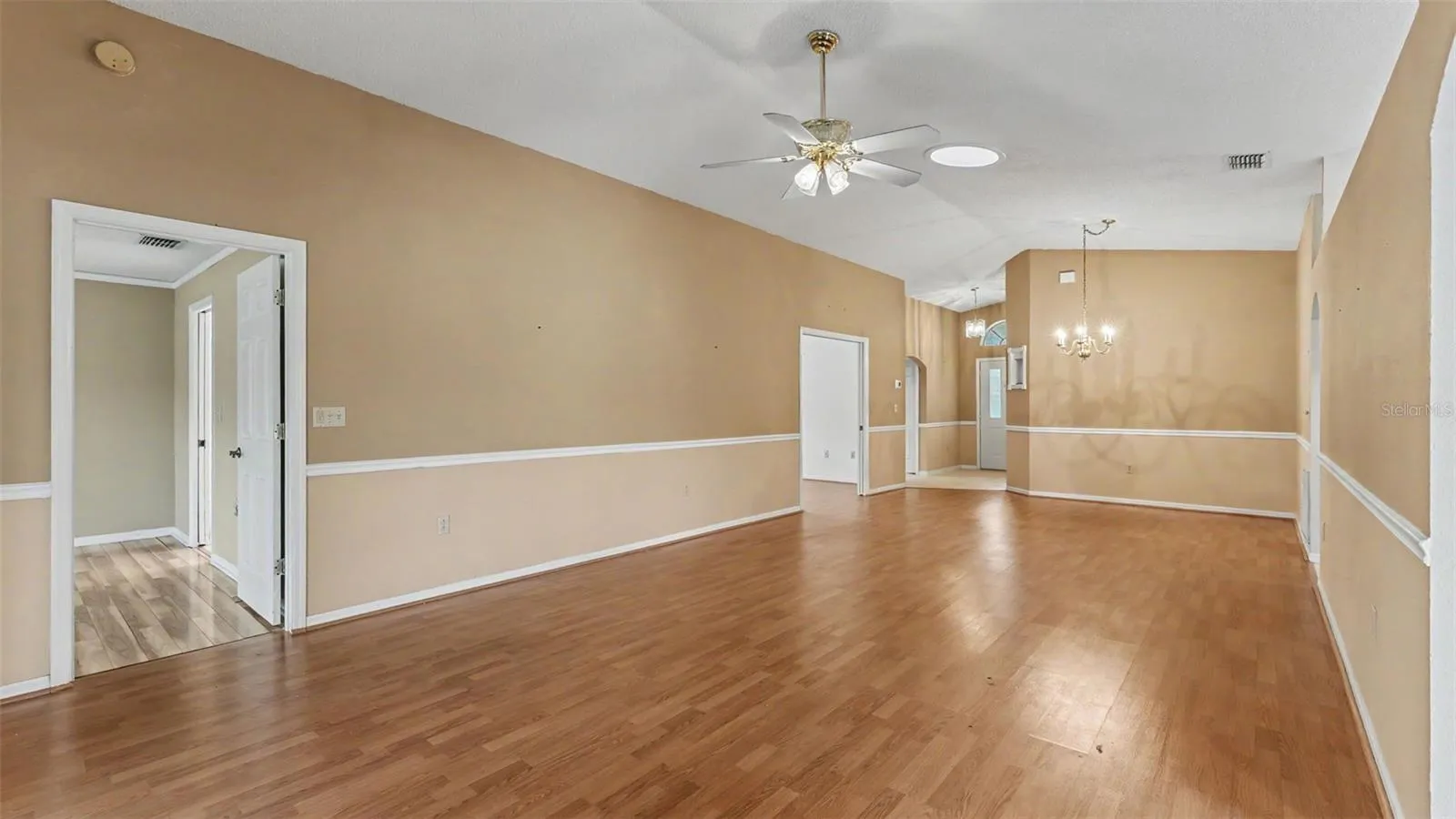Living room, entry way, and dining room