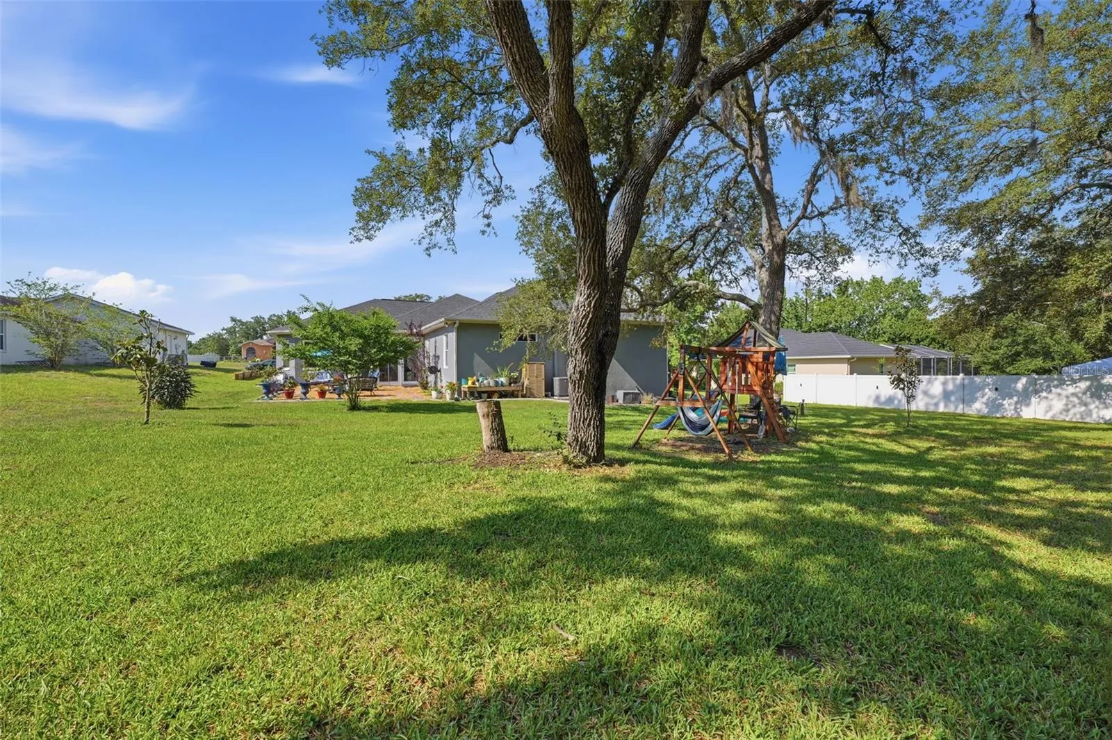 half acre of a beautiful, maintained lawn
