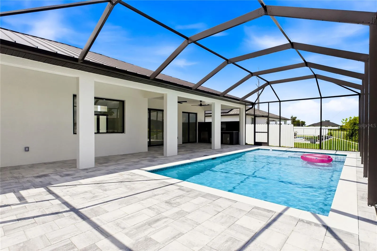 Embrace the ultimate SWFL LIFESTYLE w/ sun-soaked days in the HEATED POOL &amp; SPA and effortless entertaining under the expansive SCREENED LANAI.
