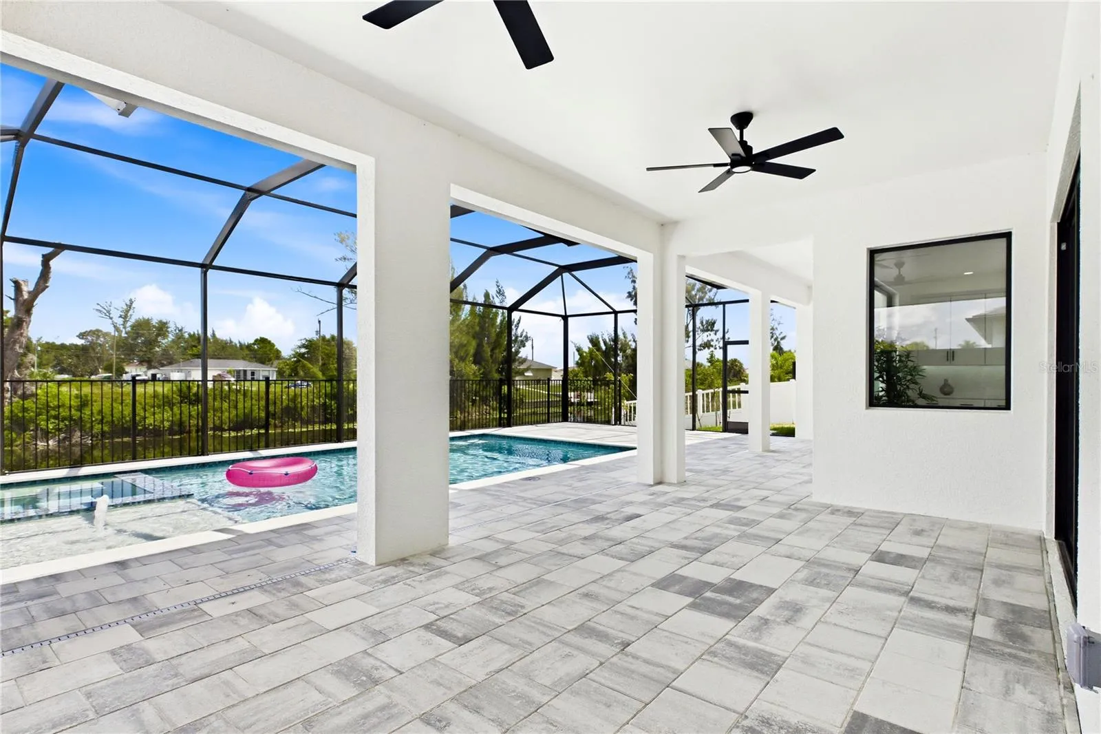 CREATE YOUR OWN OUTDOOR OASIS—dine, entertain &amp; unwind under the expansive COVERED LANAI while enjoying POOLSIDE BREEZES &amp; the laid-back SWFL WATERFRONT LIFESTYLE!