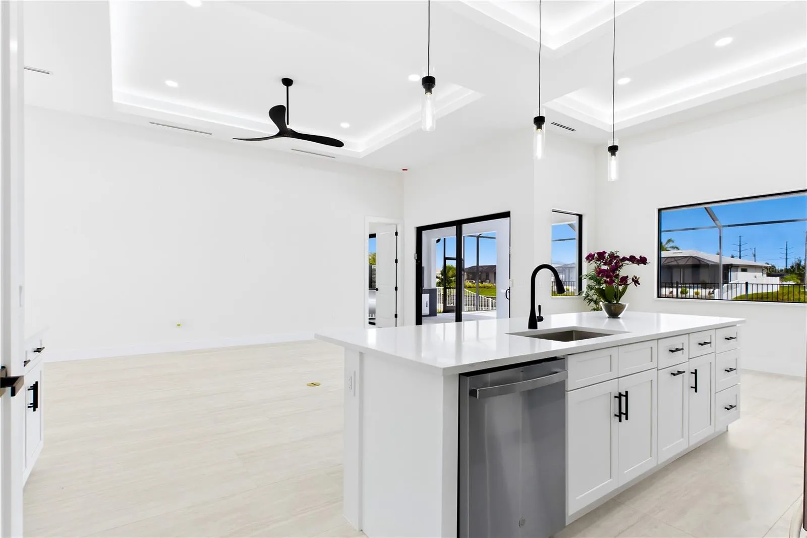 Oversized WATERFALL ISLAND w/ striking vertical WOOD SLAT DETAILING &amp; abundant storage.