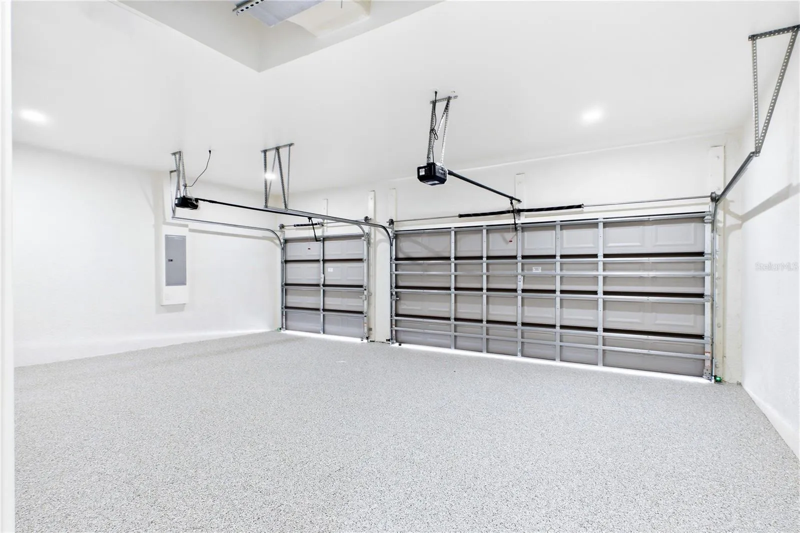 SPACIOUS 3-CAR GARAGE w/ durable EPOXY FLOORING offers plenty of room for vehicles, storage, bikes, water toys &amp; all your SWFL LIFESTYLE essentials!