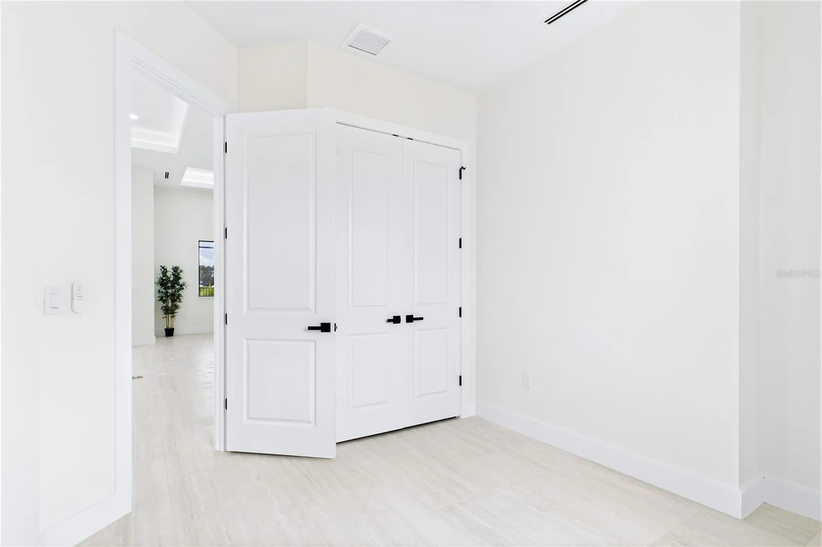VERSATILE FOURTH BEDROOM offers the flexibility to fit your lifestyle; ideal as a private HOME OFFICE, DEN, STUDY, guest room or creative space.
