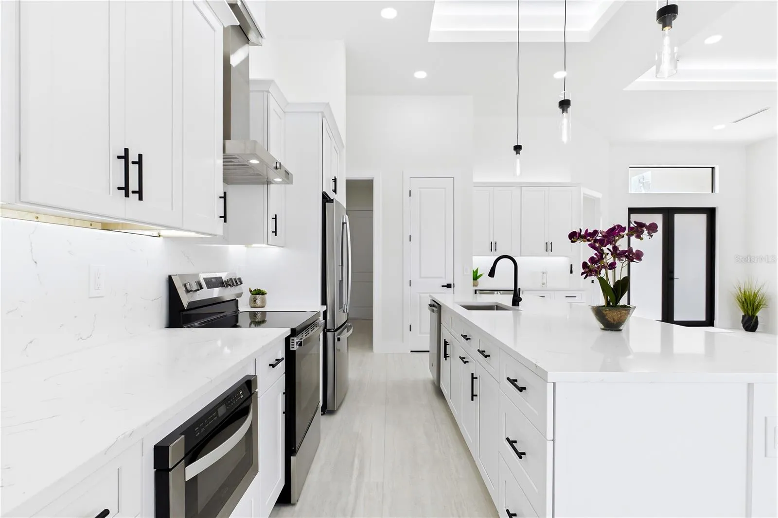 Equipped w/ SS appliances, French-door refrigerator, microwave, smooth-top range, commercial HOOD &amp; dishwasher.