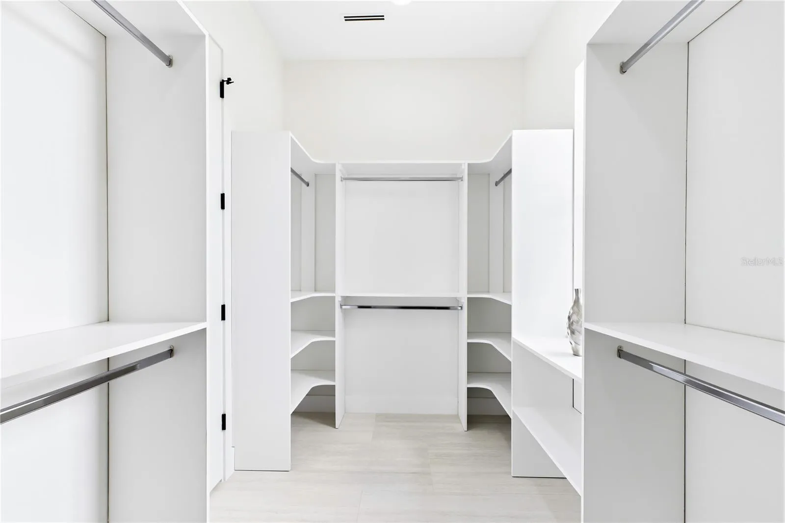 START &amp; END YOUR DAY ORGANIZED w/ an expansive CUSTOM WALK-IN CLOSET offering abundant built-in shelving &amp; hanging space for effortless everyday living!