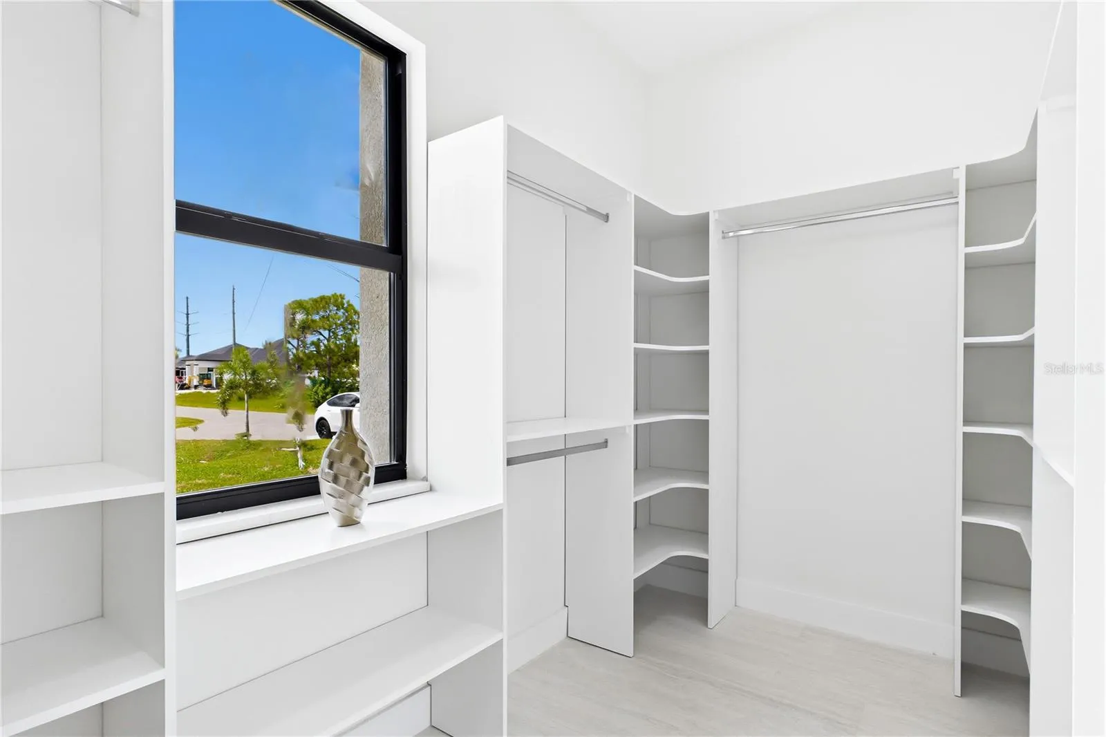BUILT-IN CUSTOM CLOSET WHITE CABINETRY for ADDED STORAGE &amp; CLEAN, UPSCALE LOOK.