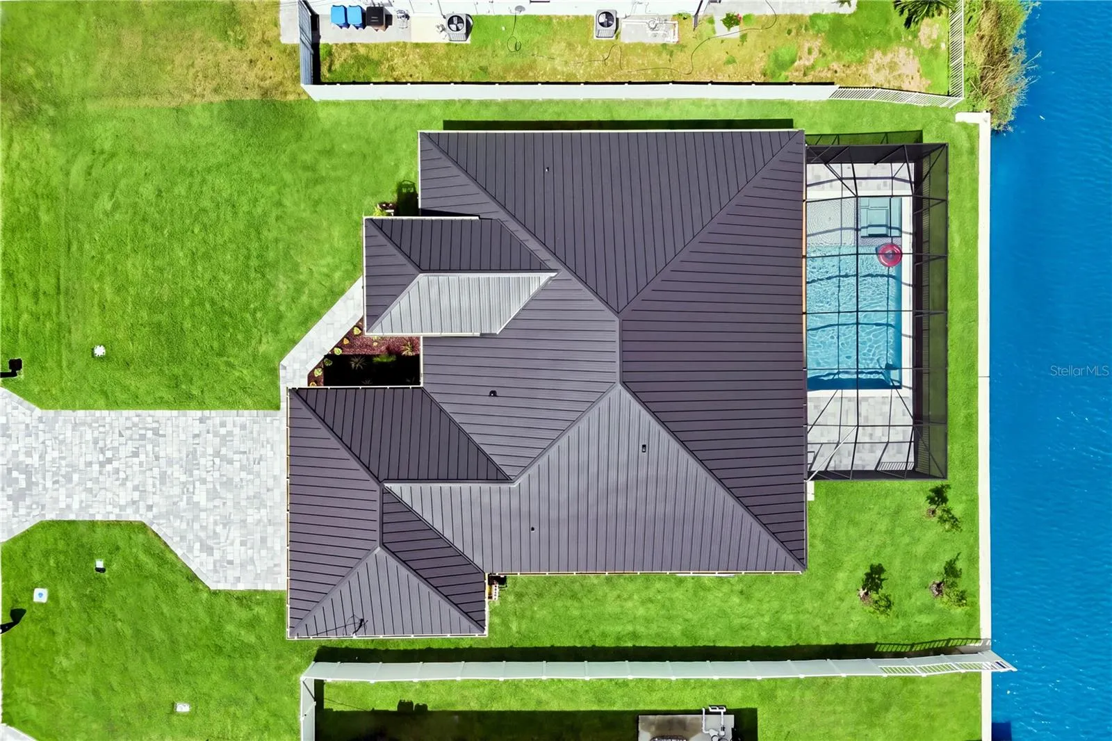 Located in SW Cape Coral, durable METAL ROOF &amp; 3-CAR GARAGE!