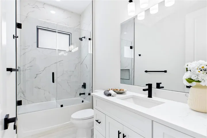 STYLISH HALL BATHROOM makes everyday routines effortless w/ a bright modern design, QUARTZ vanity &amp; beautifully tiled TUB/SHOWER. Perfectly positioned for FAMILY &amp; GUESTS while maintaining the home’s cohesive CONTEMPORARY STYLE!