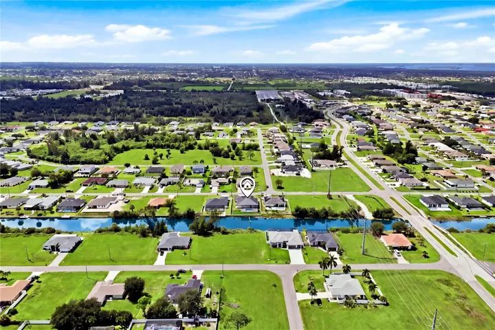 Experience modern elegance, serene canal views, upscale finishes, stunning screened spa &amp; pool with EXCEPTIONAL SWFL living!