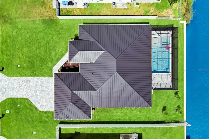 Located in SW Cape Coral, durable METAL ROOF &amp; 3-CAR GARAGE!