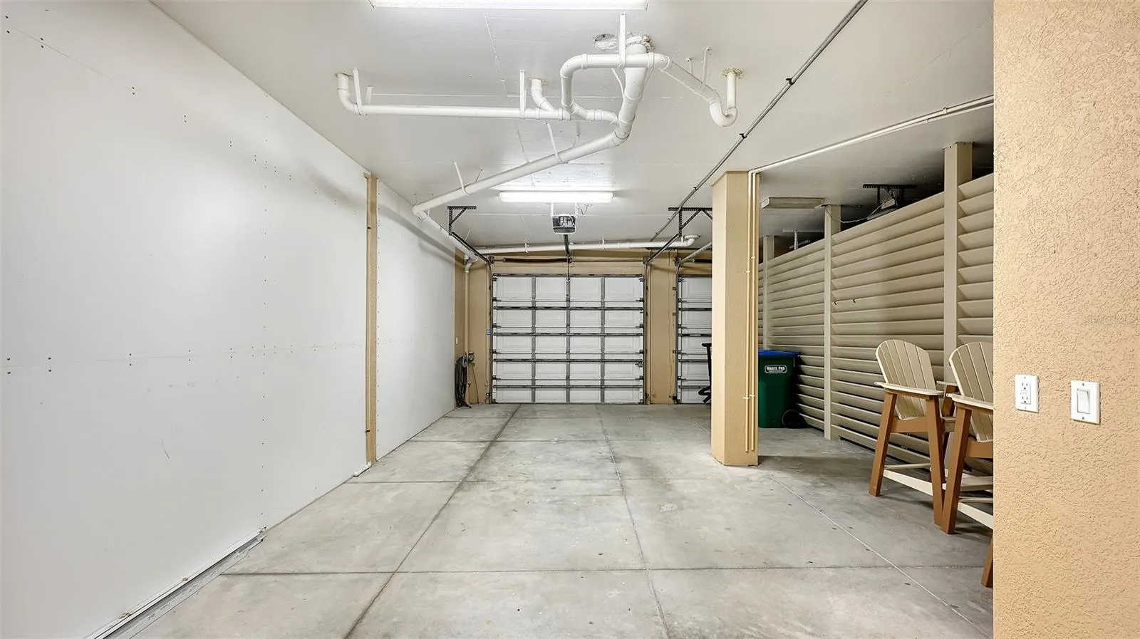 private tandem garage with storage space for bikes, scooters,beach toys, golf cart