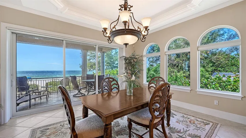 Formal dining area can accommodate a larger table and chairs comfortably.