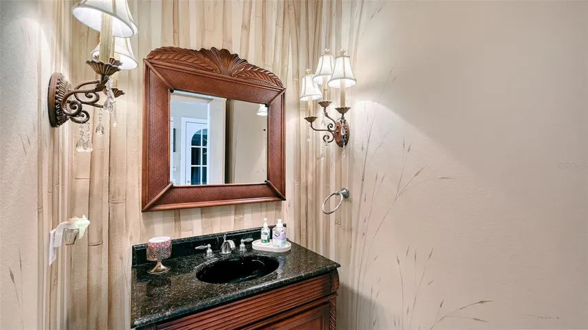 Half bath between kitchen and bedrooms is also convenient to the elevator.