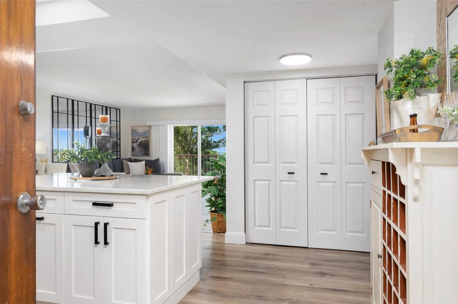 Full size washer and dryer are behind the double bifold doors