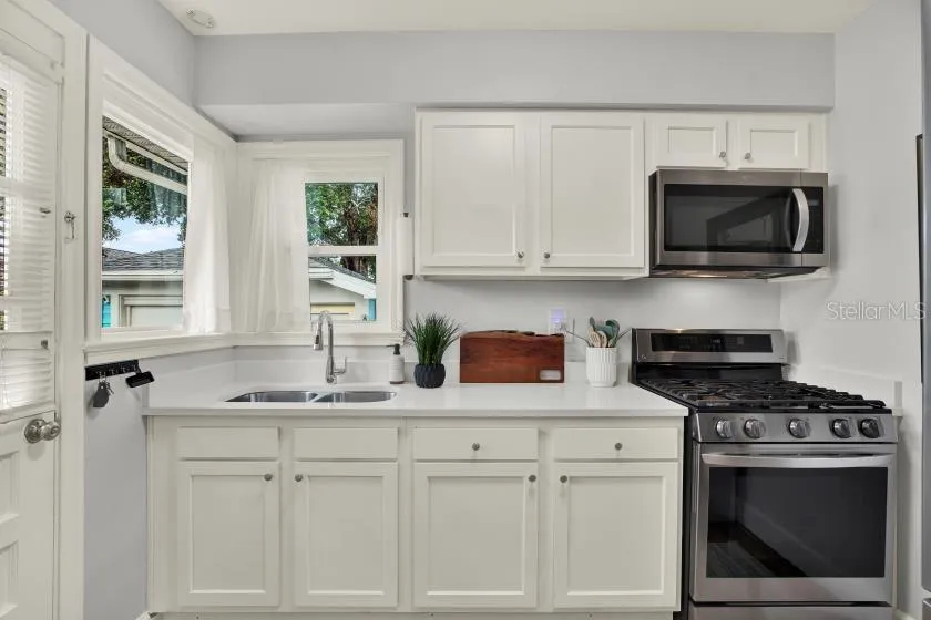 Newer kitchen with newer stainless steel appliances.  Gas stove and convection oven