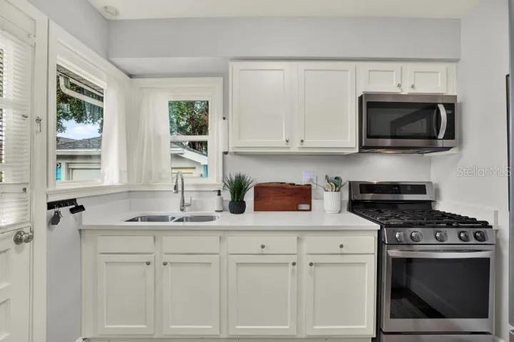 Newer kitchen with newer stainless steel appliances.  Gas stove and convection oven
