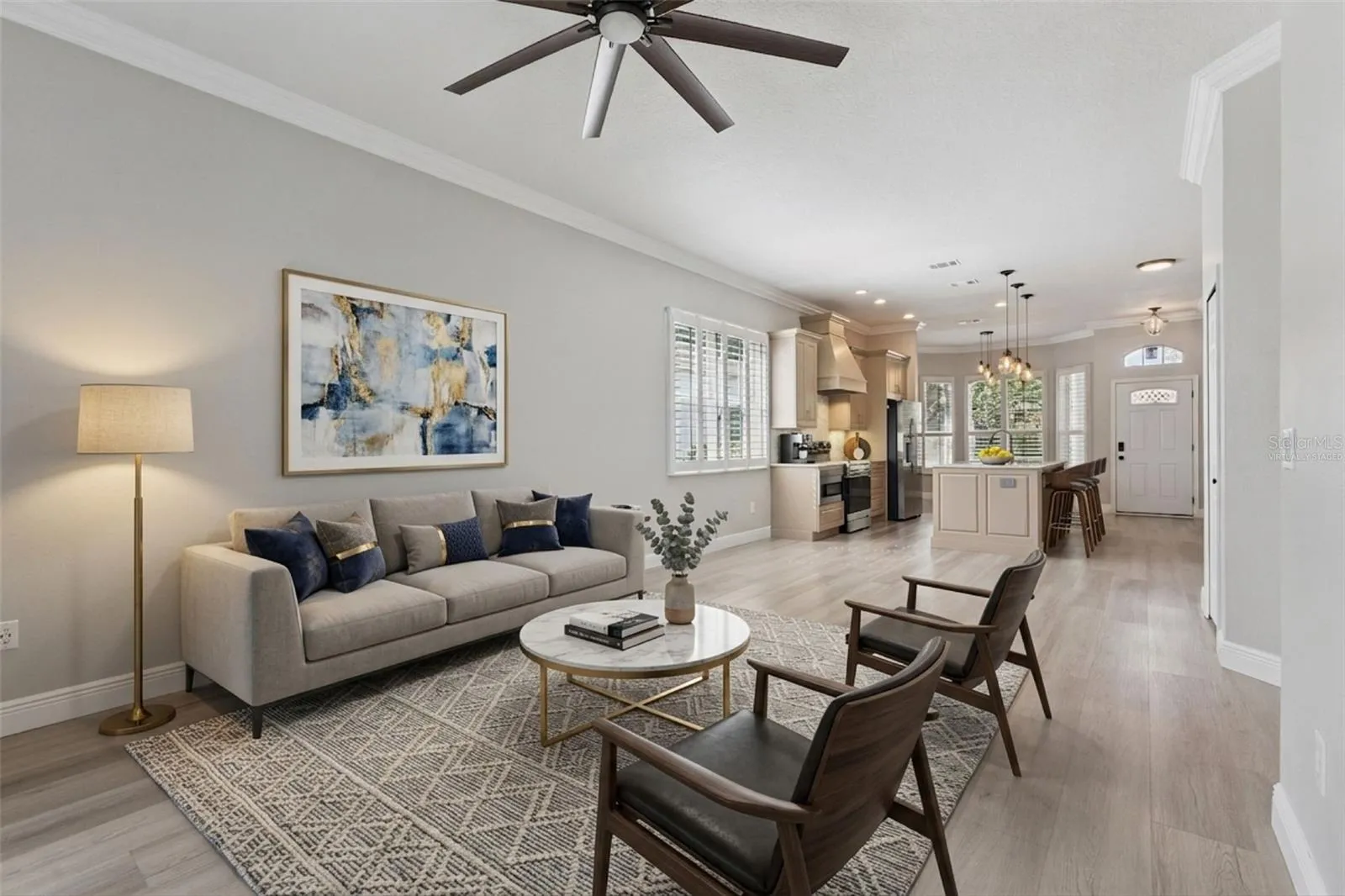 Virtually Staged. Family room/ Kitchen combo is great for entertaining or just bringing the family together.  Lots of natural light in this space!