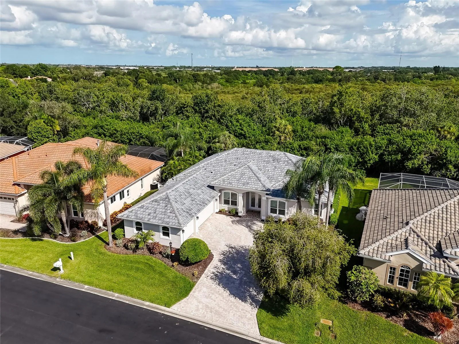 Gated, 2026 tile roof, impact glass, 3 car garage & pvt. mail box.