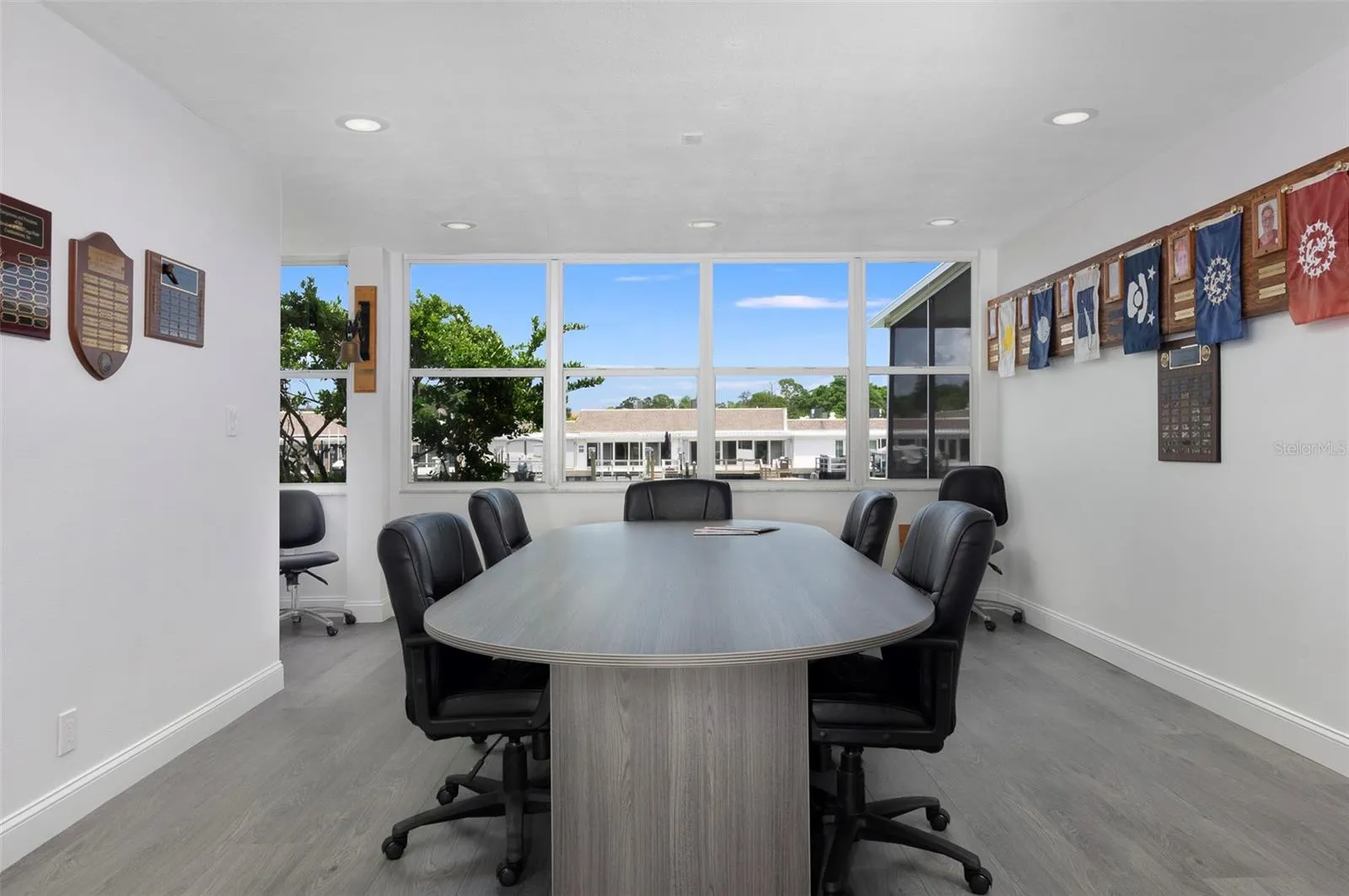 The community has 2 clubhouses. All have been renovated. This is one of the many areas where you can hold meetings. This Clubhouse is right on the water.