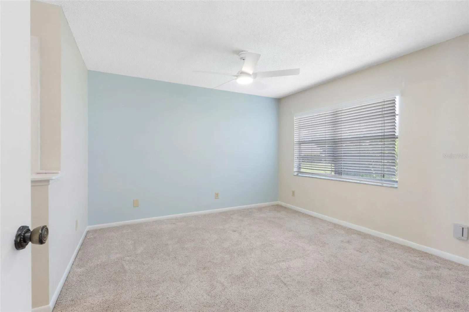 Primary Bedroom with new ceiling fan
