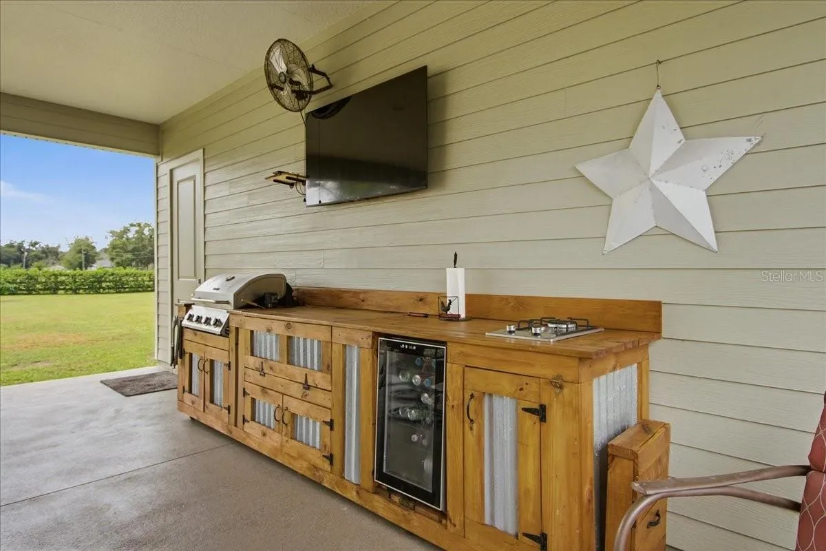 Cowboy Kitchen with Blackstone, bar-b-que grill &amp; refrigerator