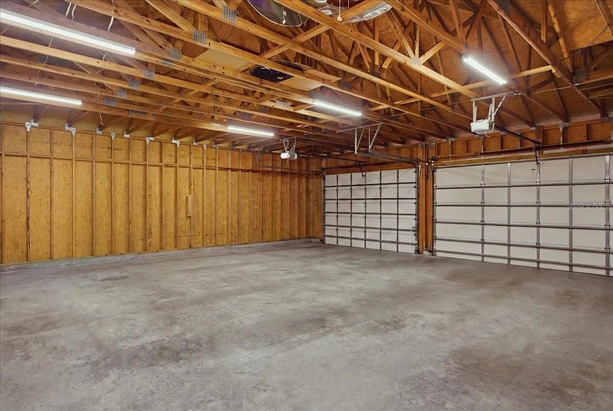 Three Car Garage w/exposed rafters