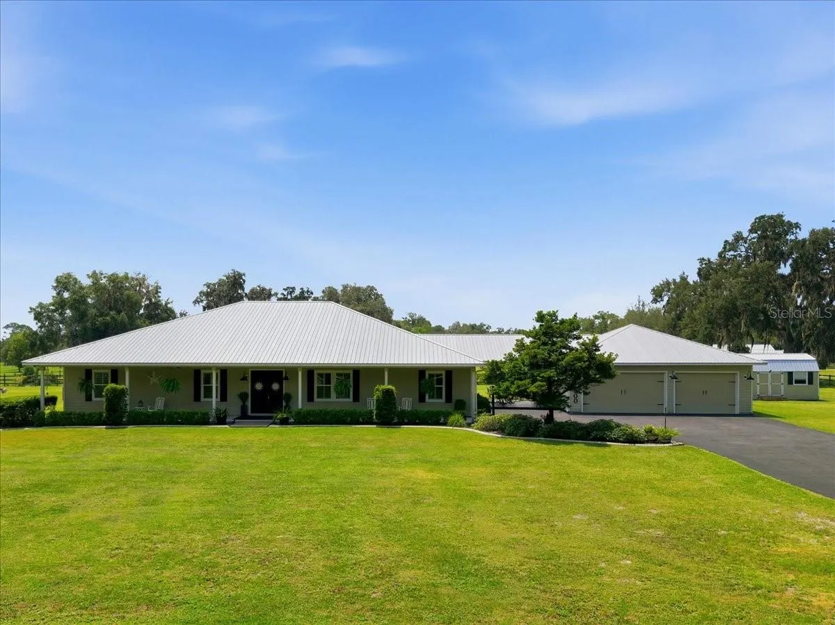 Full view of House with Garage