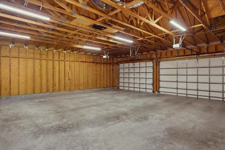 Three Car Garage w/exposed rafters