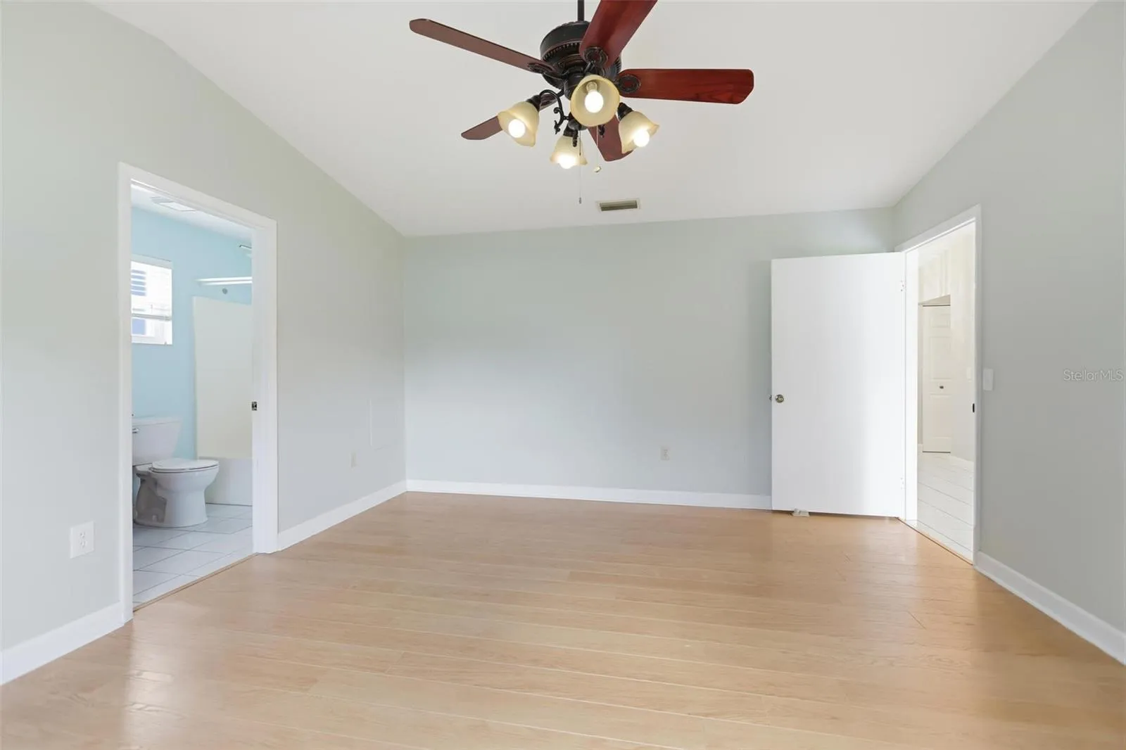 Primary Bedroom with view of bath