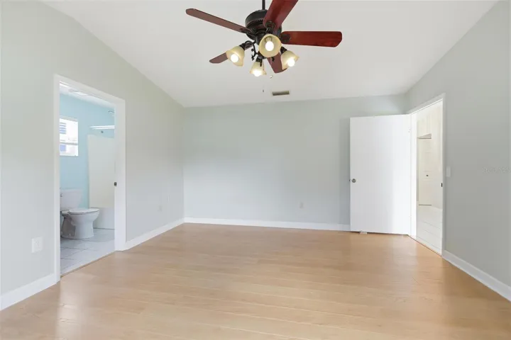 Primary Bedroom with view of bath