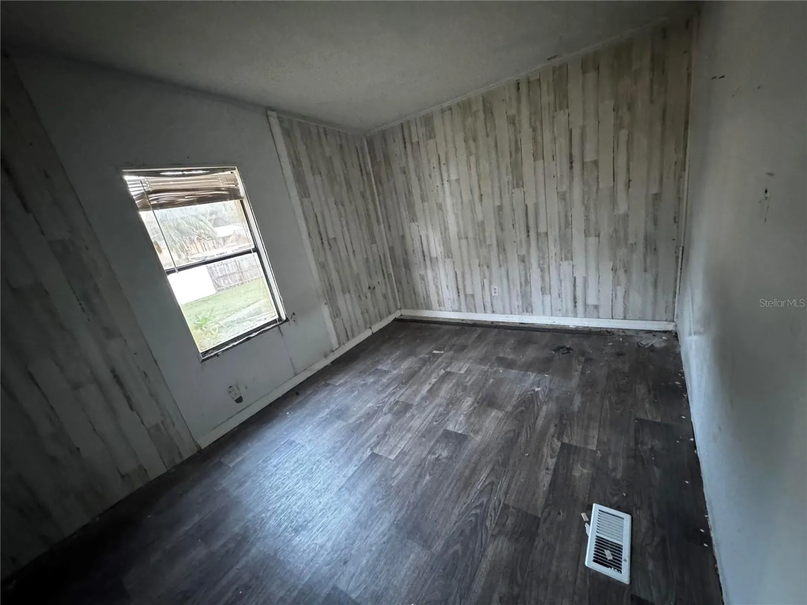 Bedroom #3 with laminate flooring and light.