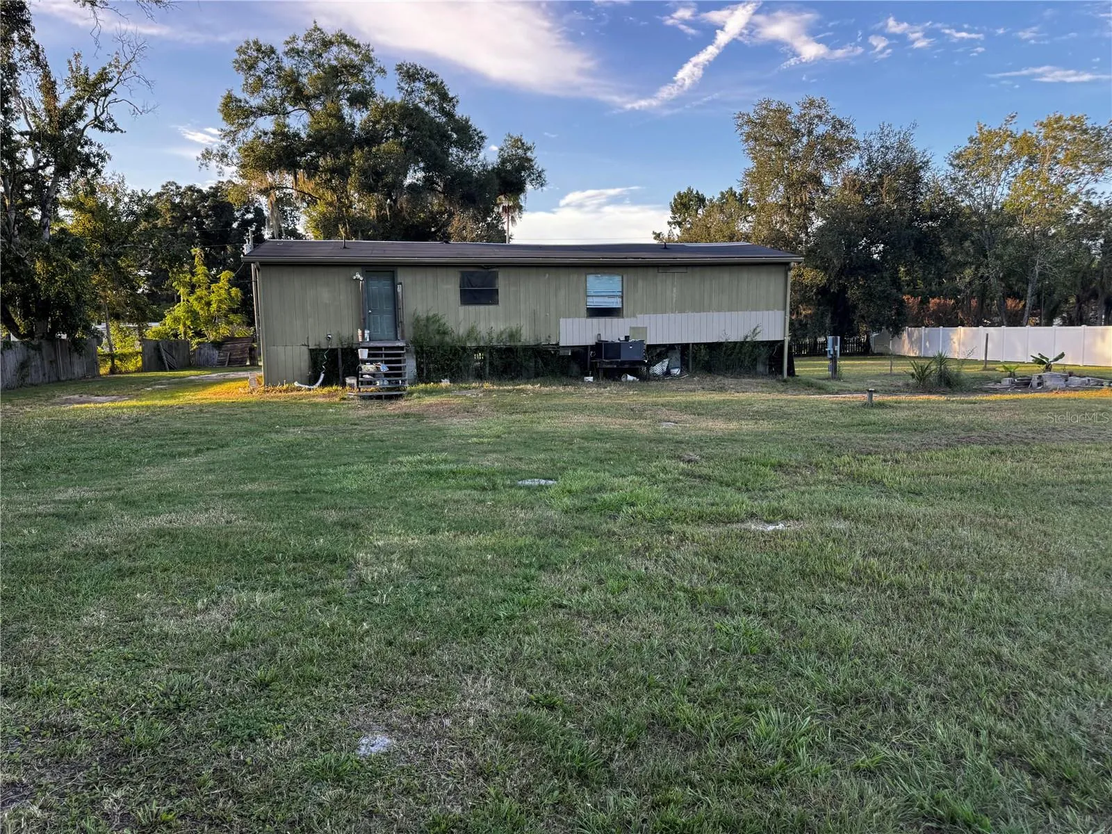 Rear view of home with lots of space all the way around
