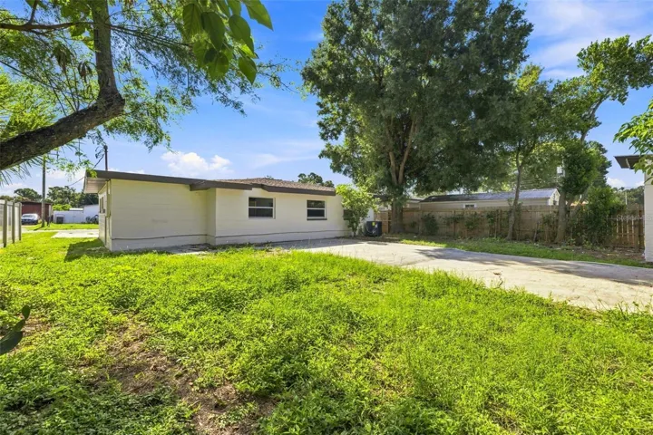 Spacious backyard with concrete patio