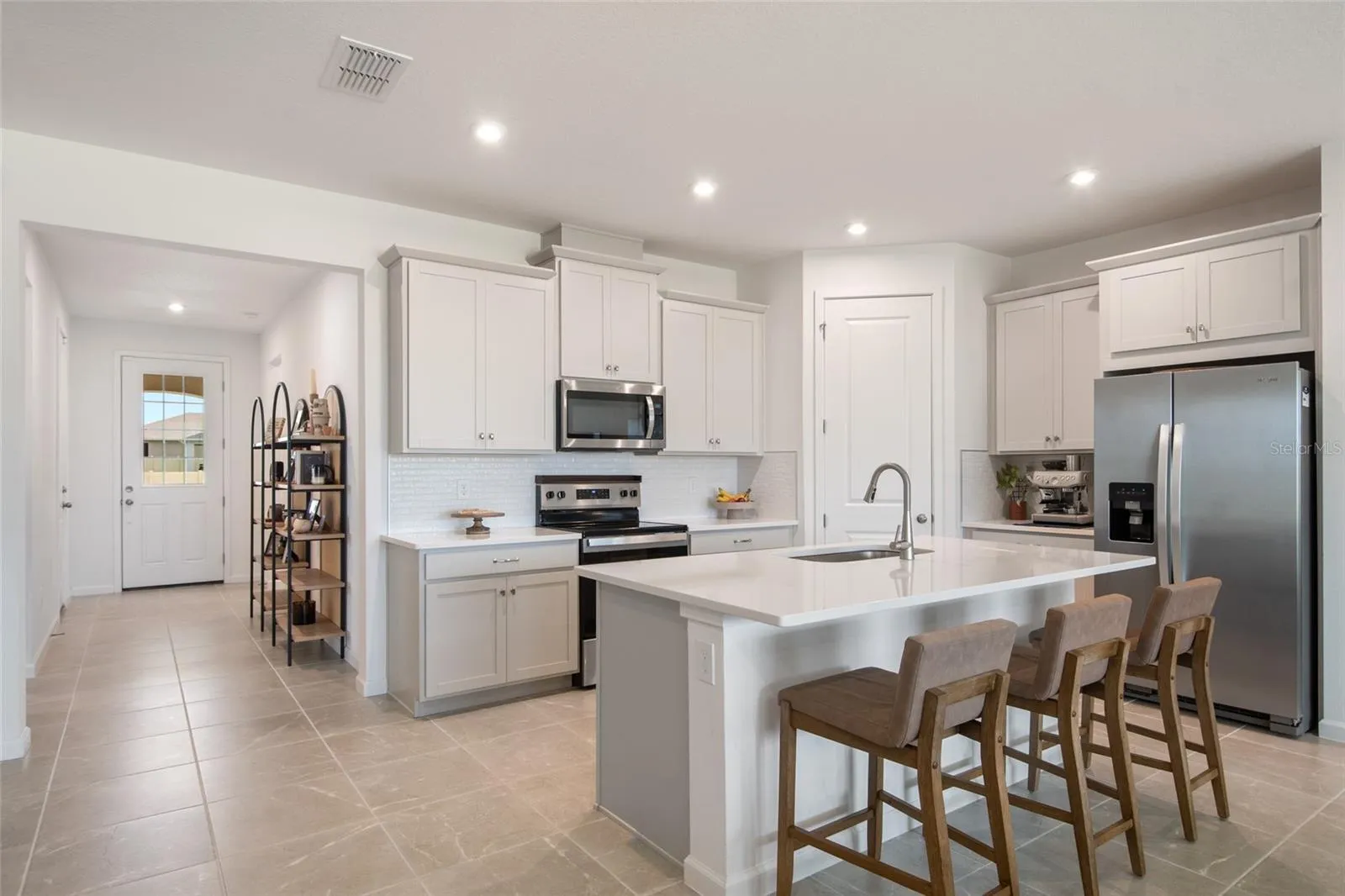 In the far corner is a dedicated walk in pantry. the Microwave and exhaust just above the range, vent to the outside!