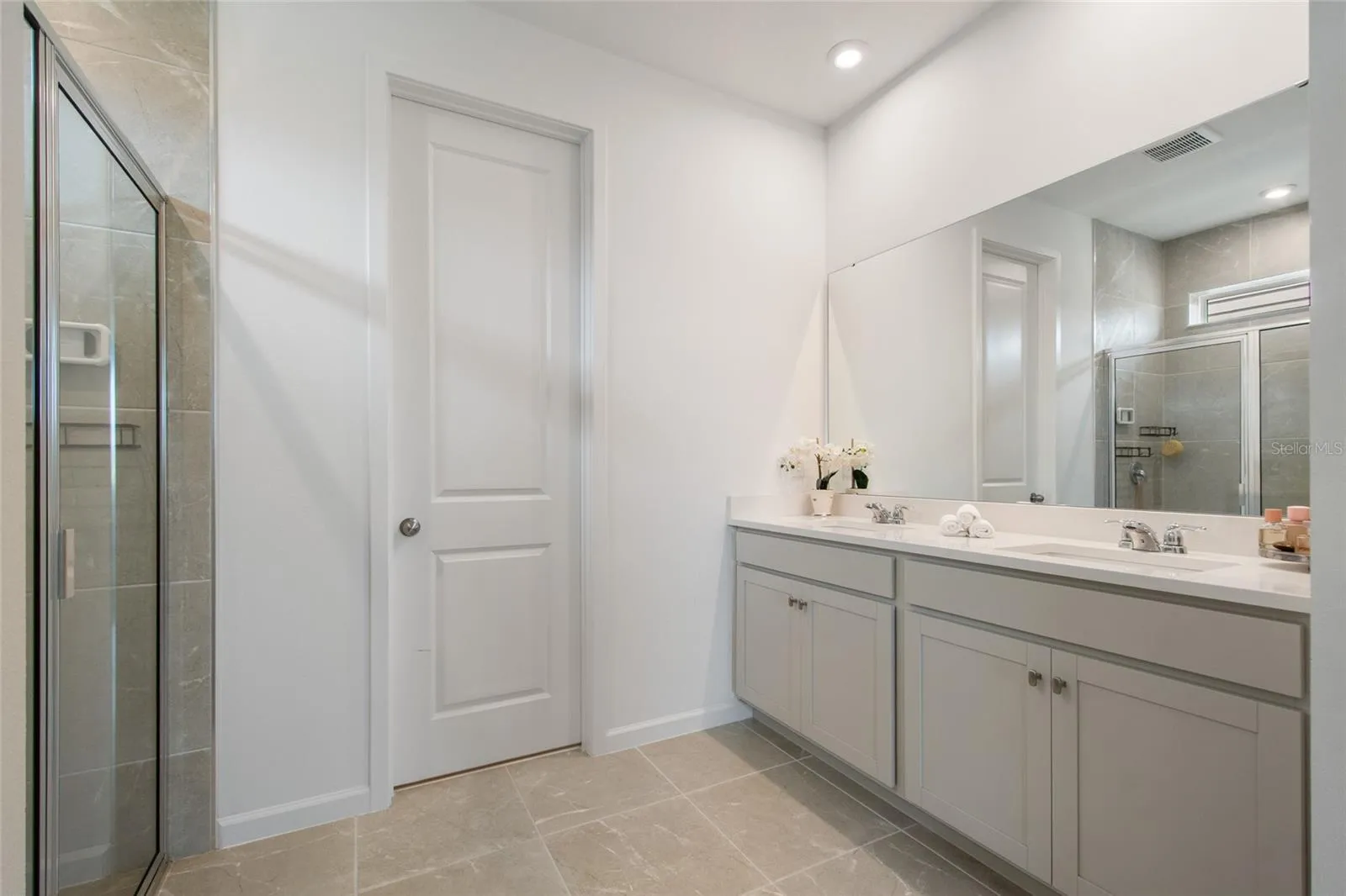 Ample space to move around the whole family could get together in this primary bathroom.