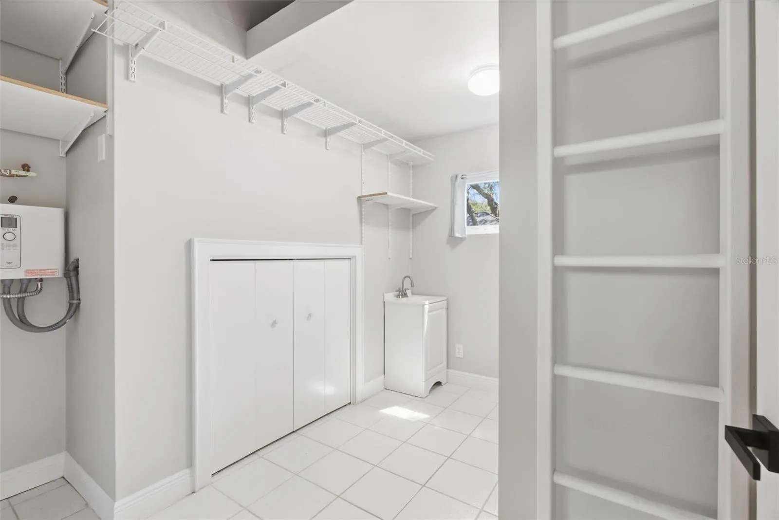 Laundry storage/tankless water heater