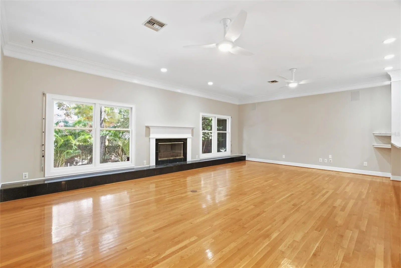 Fireplace with wall length hearth window seating