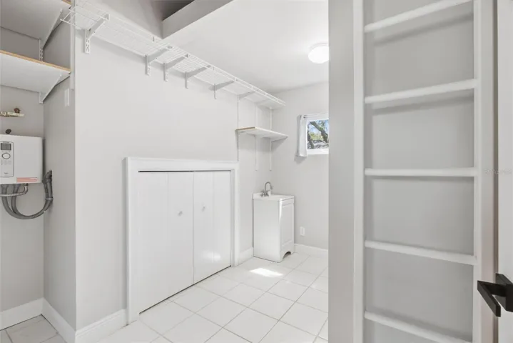 Laundry storage/tankless water heater
