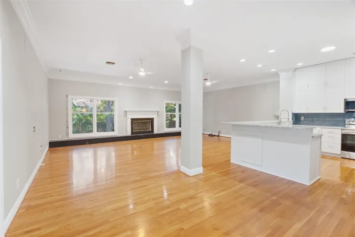Kitchen with breakfast bar, Family Room with Fireplace