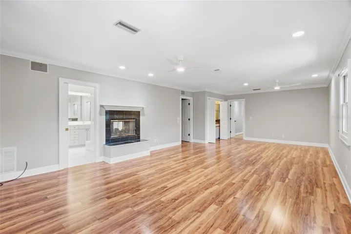 Primary suite with pass-thru fireplace, beverage bar