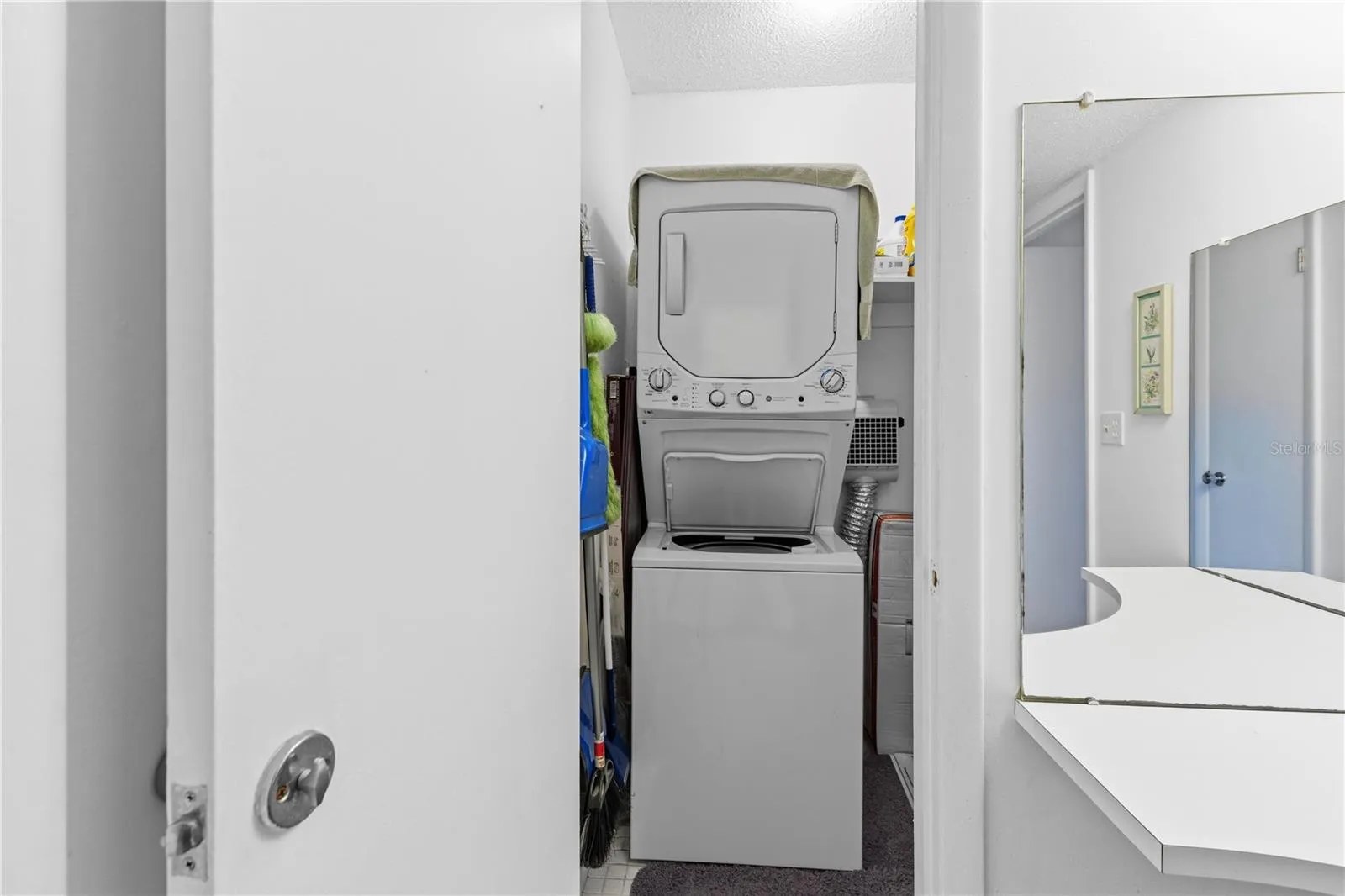 Closet with stack washer & dryer