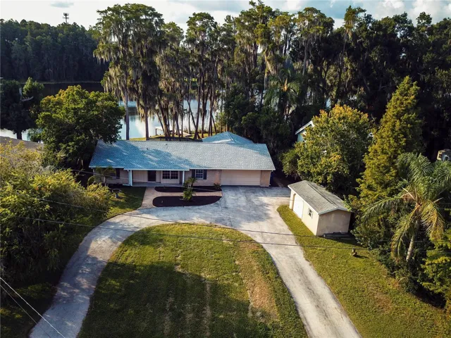 Peaceful Lakefront Retreat with waterfront views from the main living area, kitchen, dinette and Primary Suite!